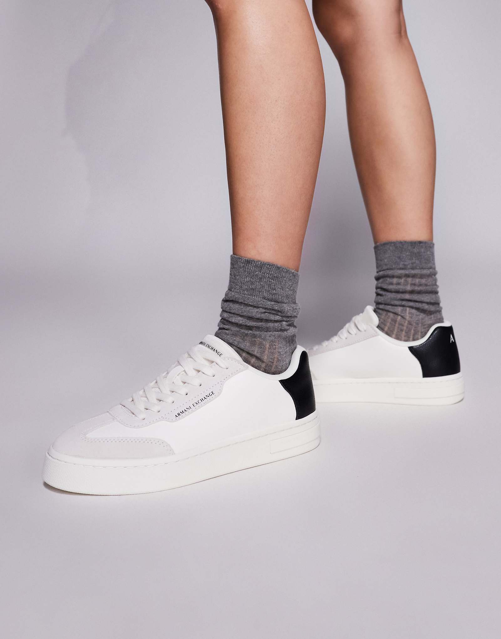 Armani Exchange logo sneakers in off white and black