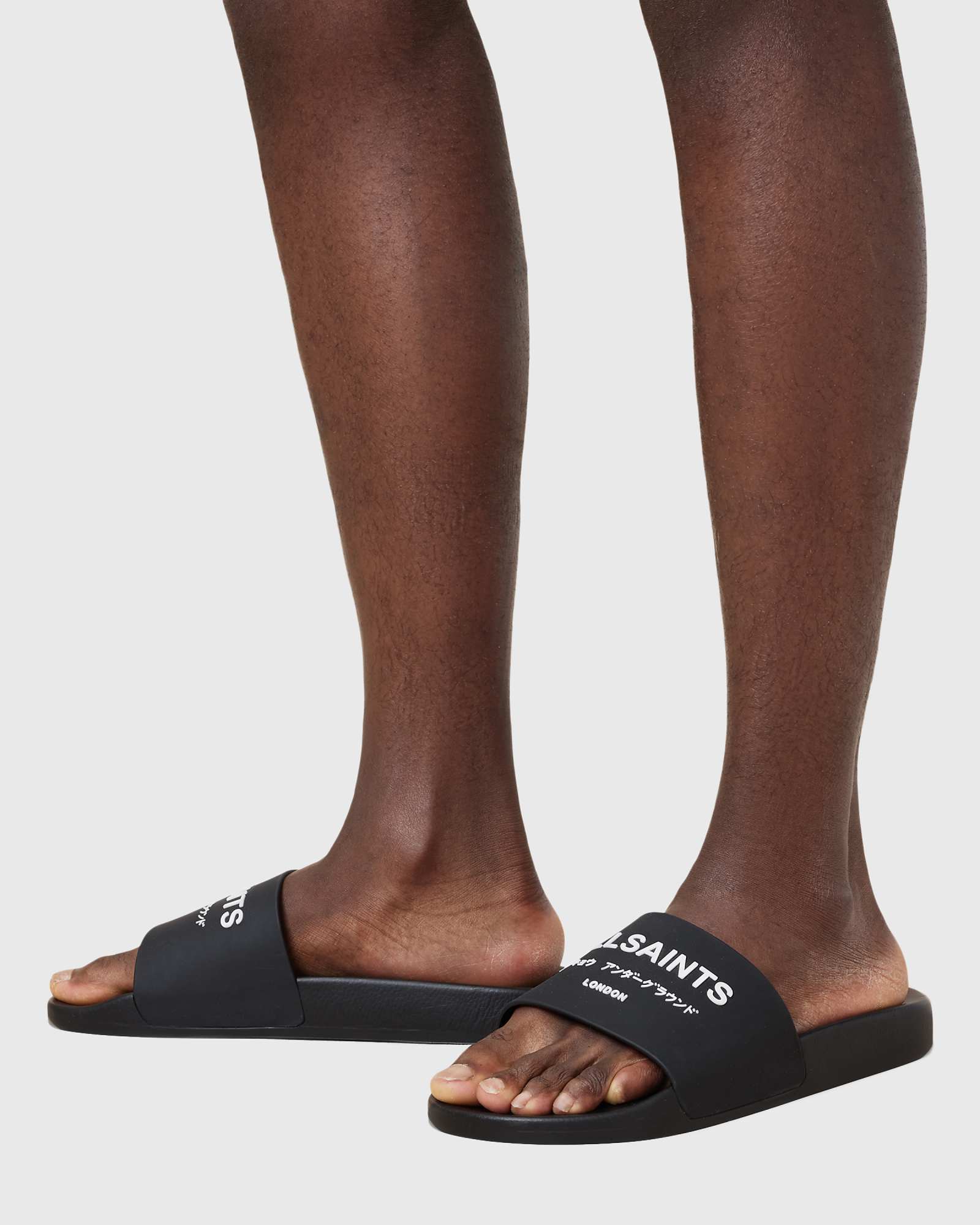 AllSaints Underground rubber slides in black 12790₽