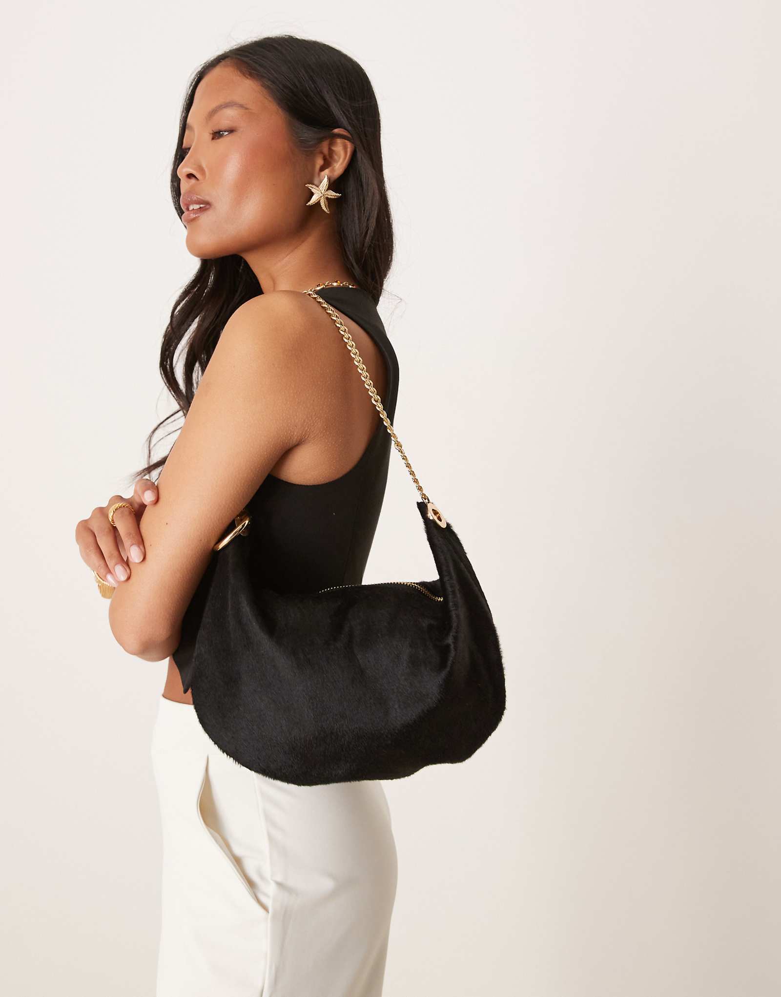 ASOS DESIGN pony hair pouch clutch with gold hardware in black 18490₽