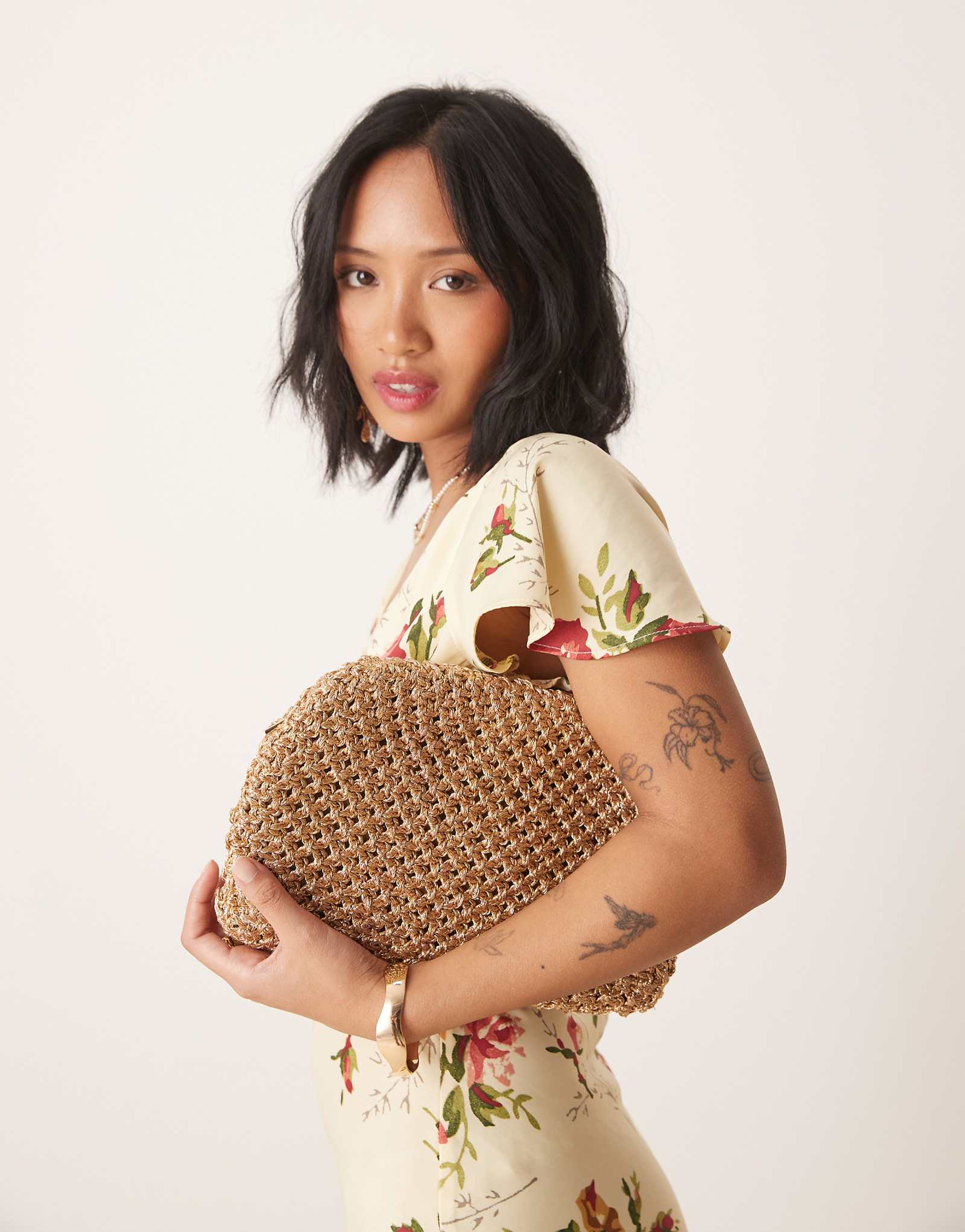 Accessorize woven metallic clutch in gold