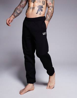 Спортивные брюки с манжетами и логотипом Armani EA7 черного цвета