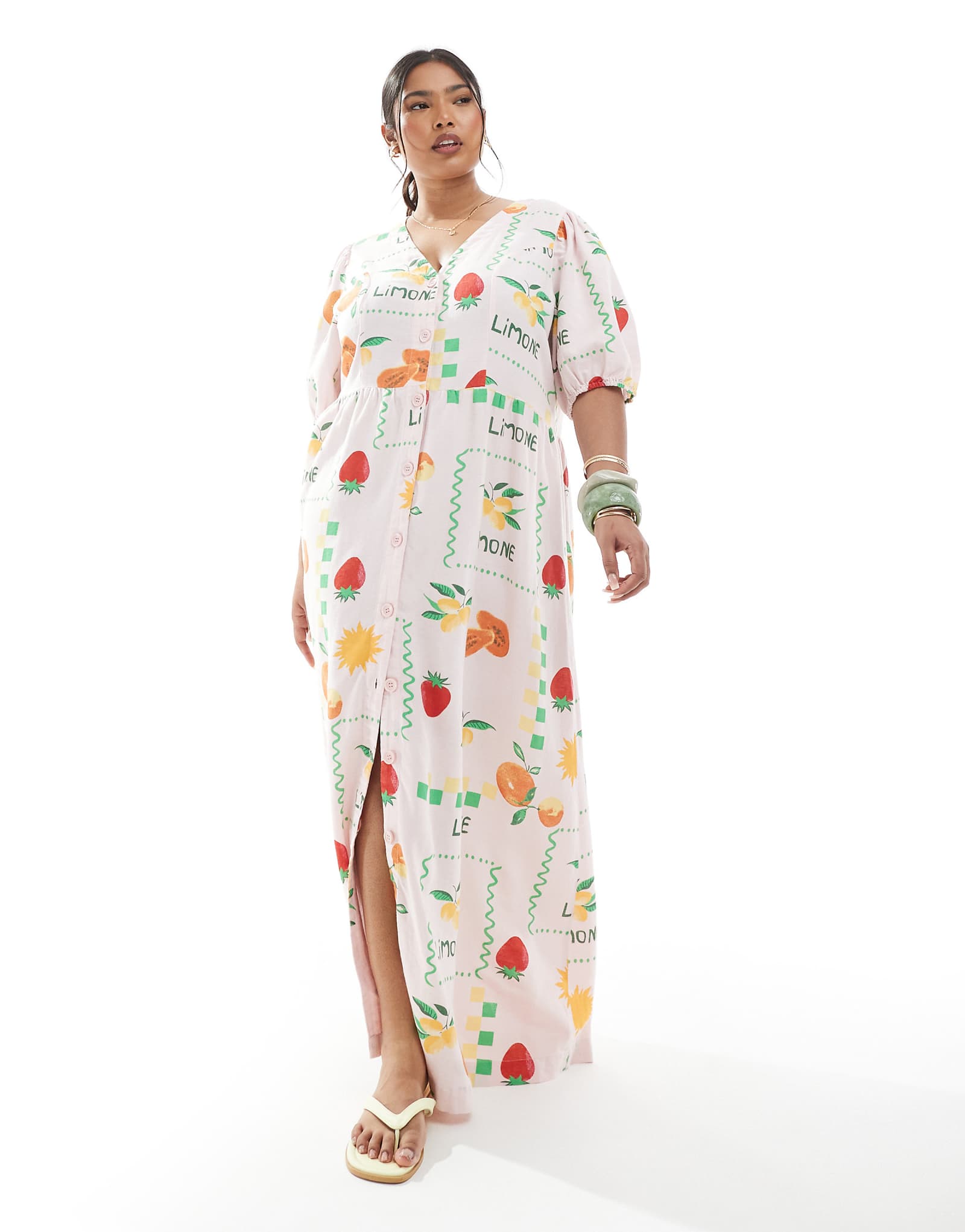 Pieces Curve puff sleeve button front maxi dress in pale pink based fruit print