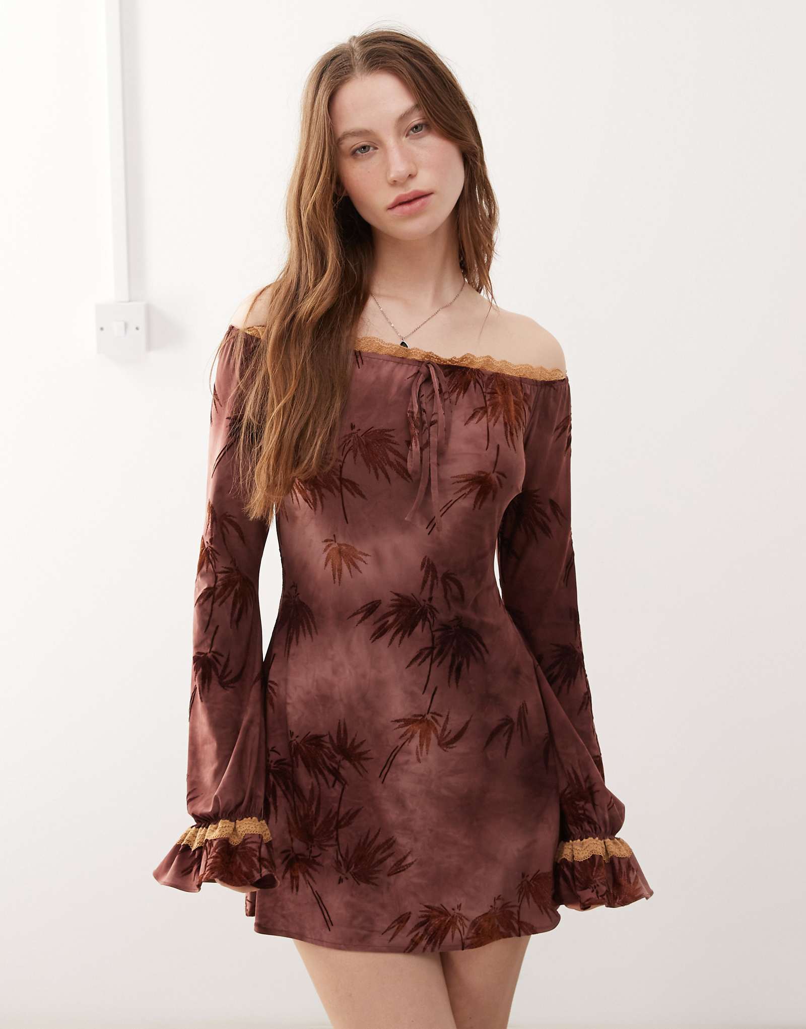 The Kript boho off the shoulder mini dress with lace detailing in burgundy print