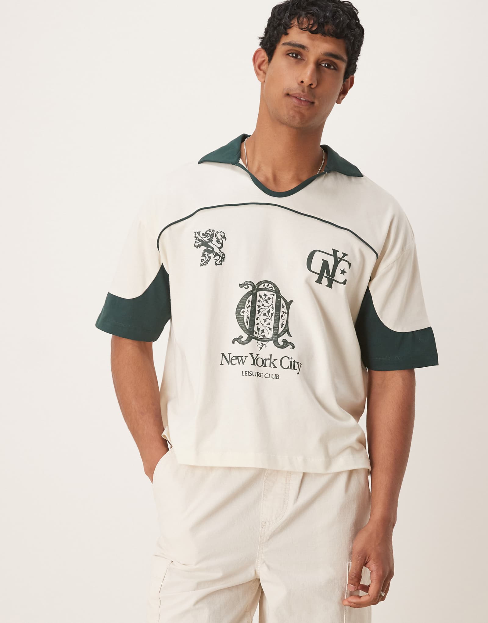 ASOS DESIGN boxy oversized polo shirt with cut and sew paneling and city graphics in cream 6090₽