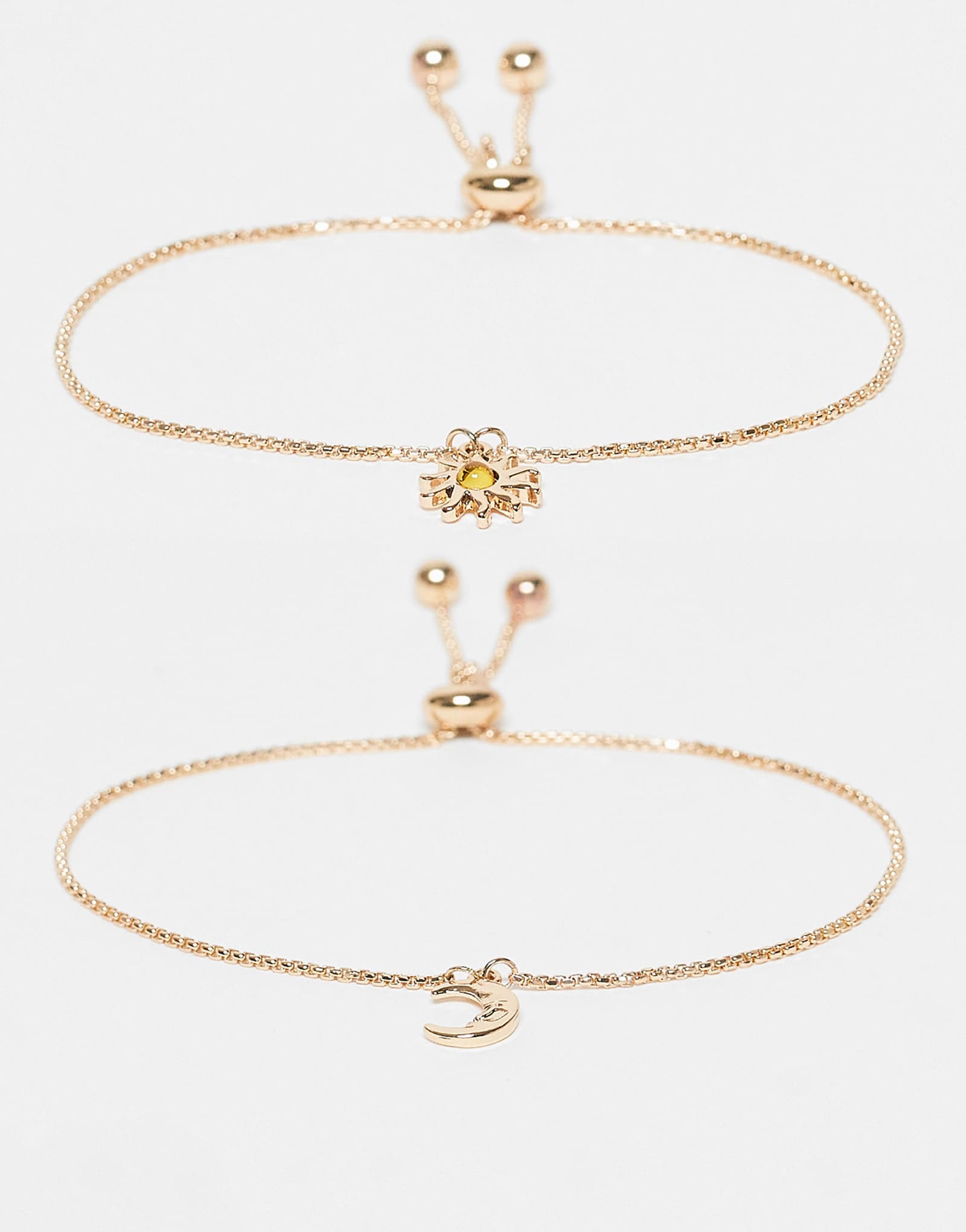 ДИЗАЙНЕРСКИЙ набор ASOS из 2 браслетов с золотыми подвесками в виде солнца и луны 2690₽