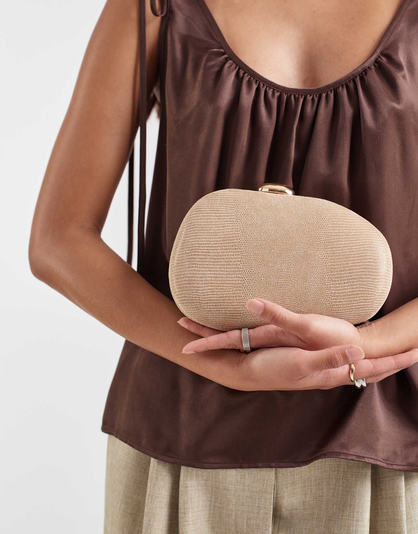 Dolce Vita Dionne hard case pearlescent clutch purse with gold-tone detail in taupe cream 24790₽