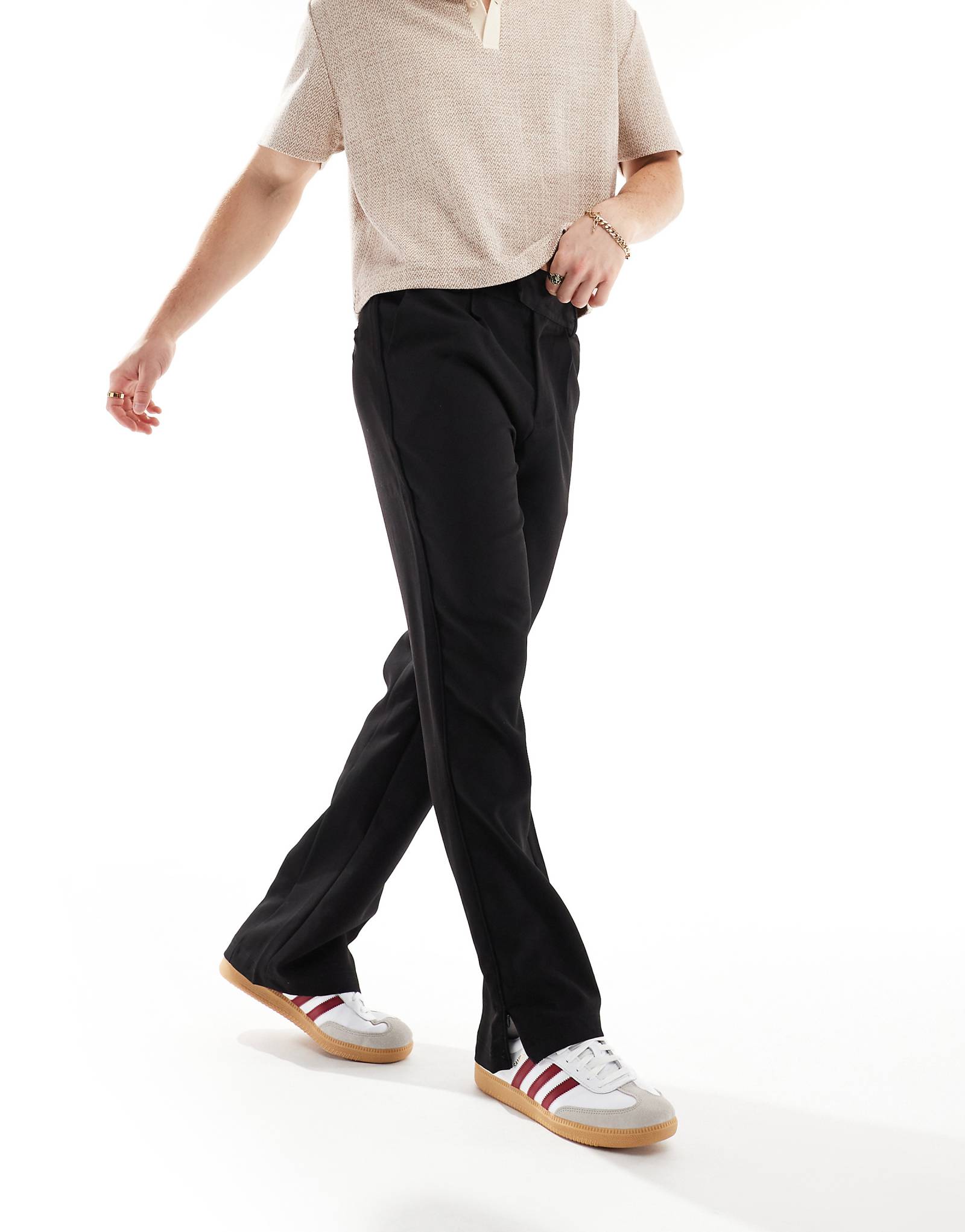 Клубные брюки от Couture черного цвета с разрезом по низу 15890₽