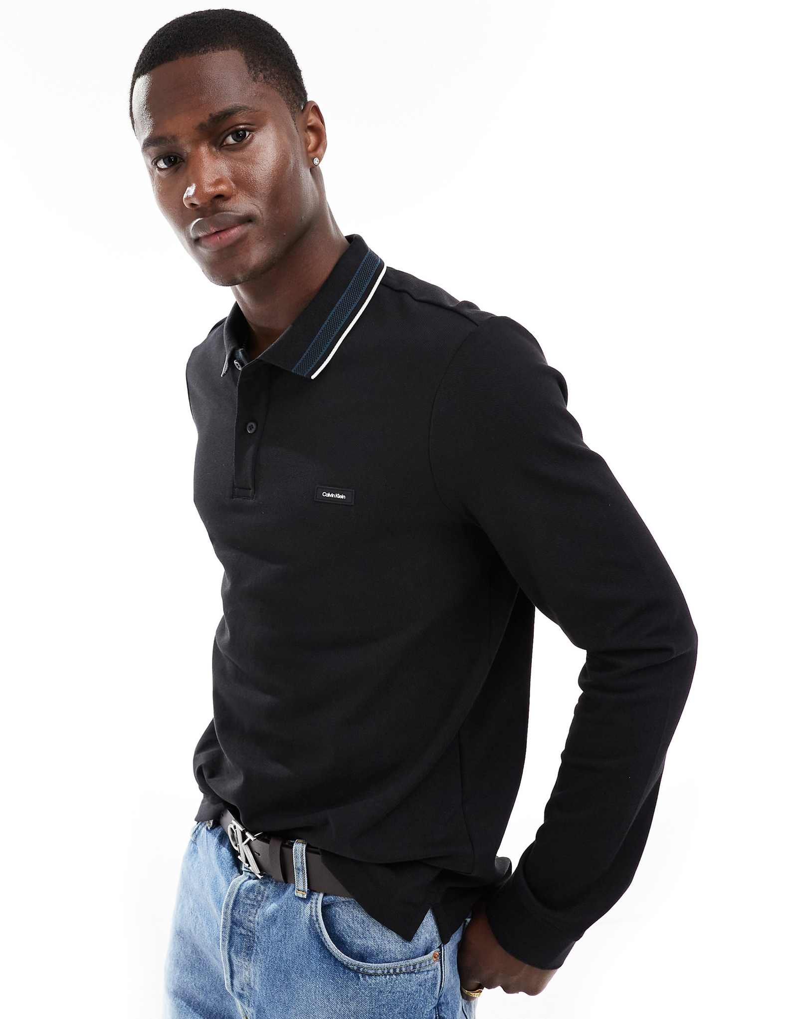 Черное поло Calvin Klein с длинным рукавом из стрейчевой ткани пике черного цвета 13190₽