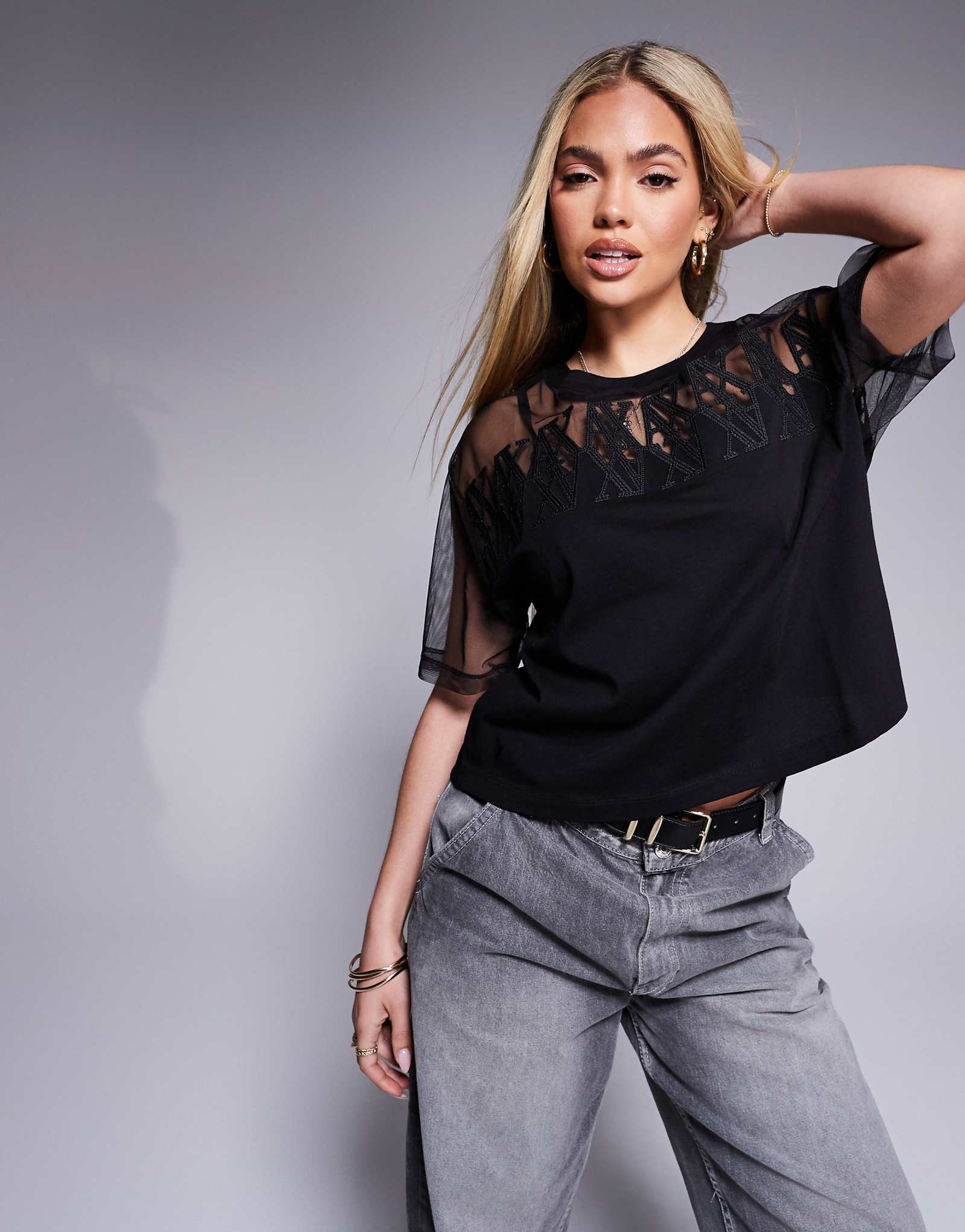 Облегающая футболка с логотипом Armani Exchange mesh черного цвета 15590₽