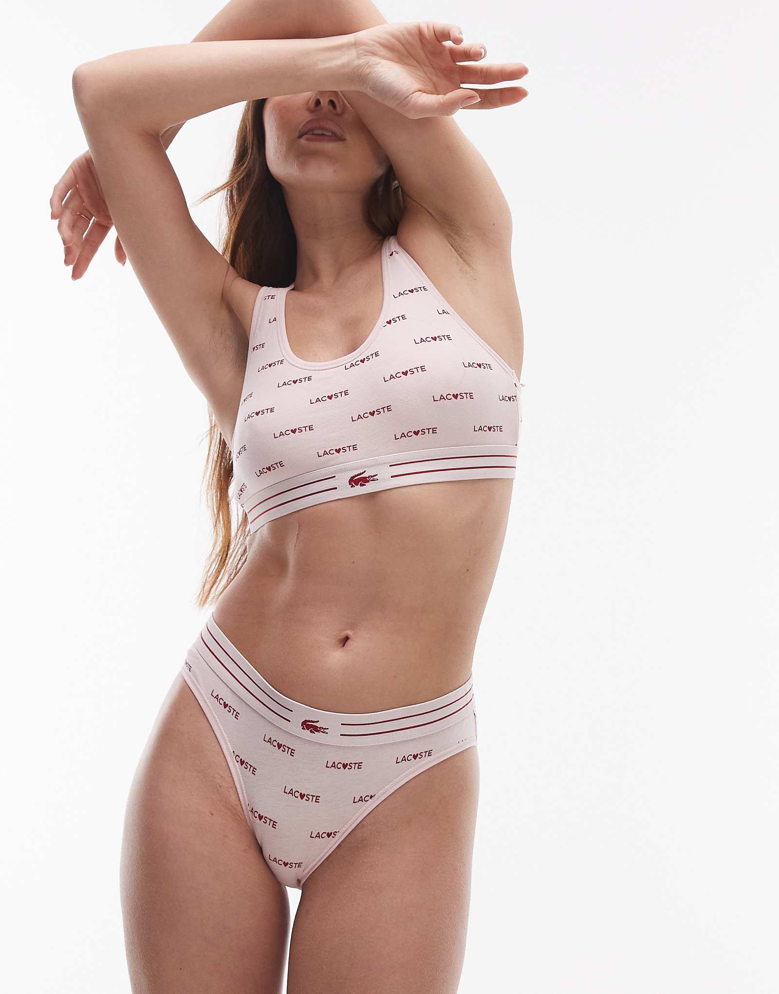 Бюстгальтер без косточек Lacoste светло-розового цвета с принтом логотипа valentines по всему телу 5690₽