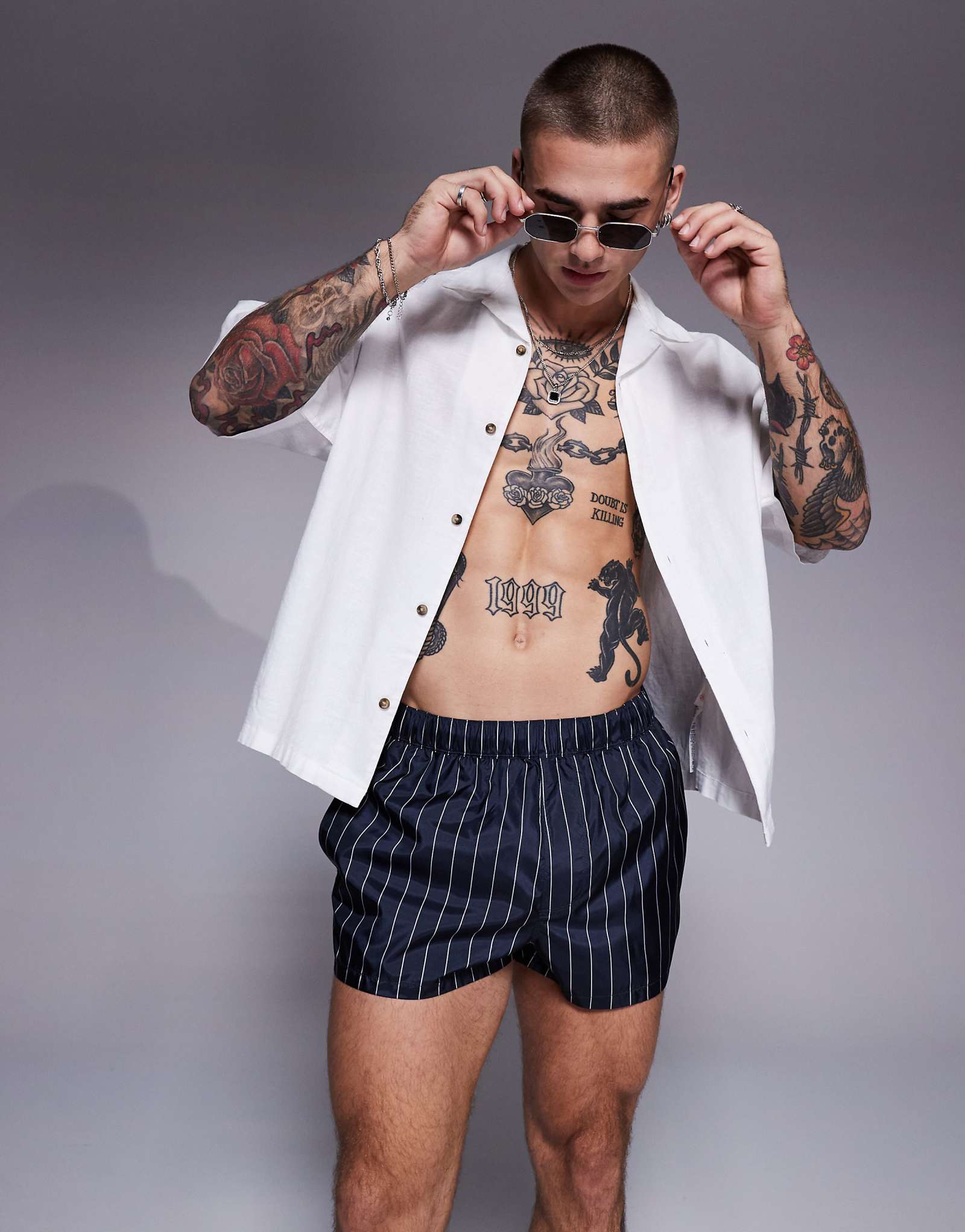 Шорты для плавания ASOS DESIGN супер короткой длины в темно-синюю и белую полоску 3090₽