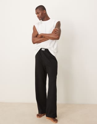 Низ для отдыха ASOS DESIGN seersucker с тканевой нашивкой черного цвета