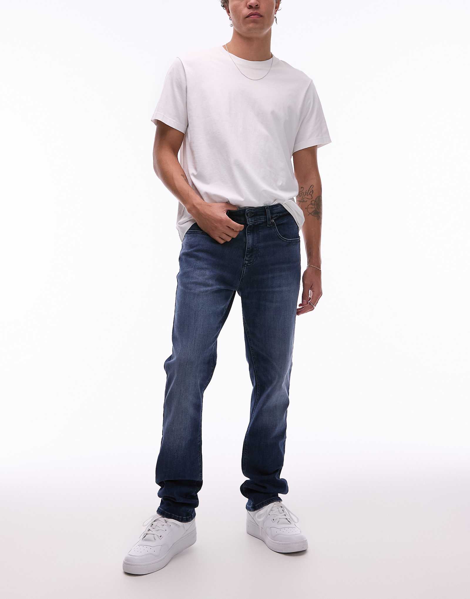 Узкие джинсы Tommy Jeans Scanton темного цвета выстиранные 16490₽