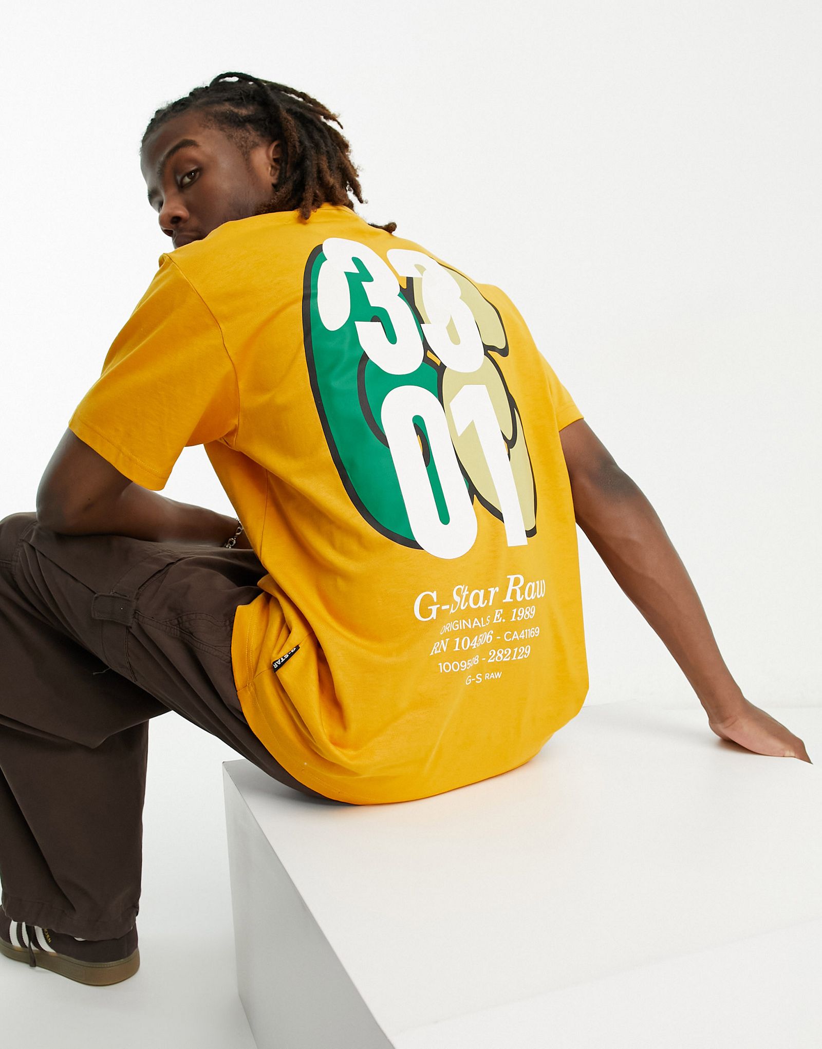 Оранжевая футболка оверсайз с принтом на спине G-Star 3301 13290₽