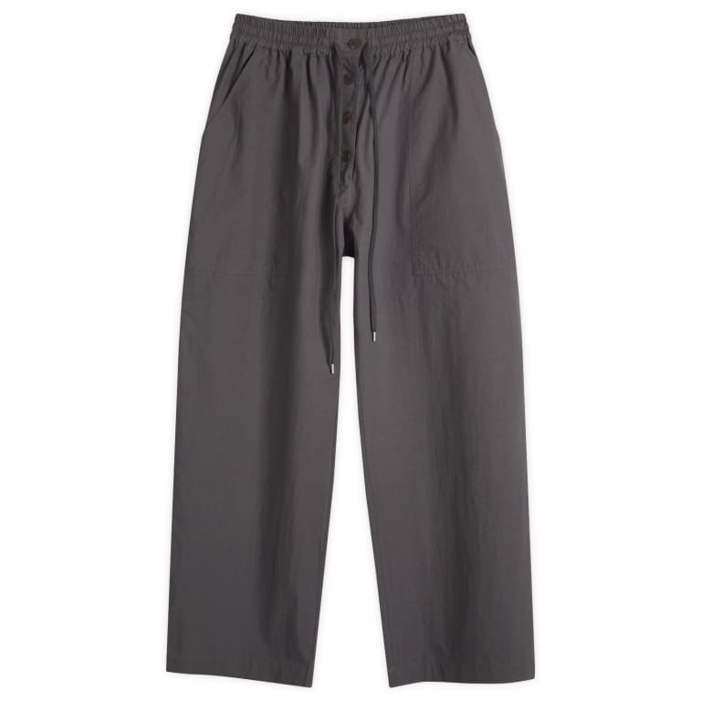 Брюки с эластичным поясом и ширинкой на пуговицах от Studio Nicholson