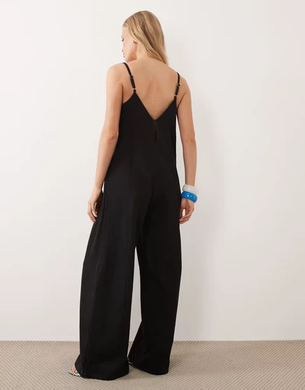 Женский джинсовый комбинезон ASOS Design клеш, черный
