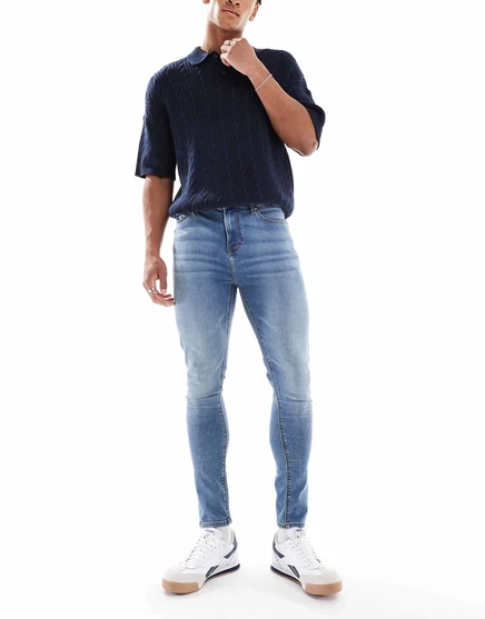 Синие эластичные джинсы средней степени стирки ASOS DESIGN Power mid wash blue