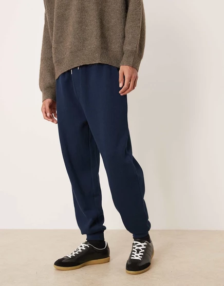 Зауженные спортивные брюки с манжетами ASOS DESIGN темно-синего цвета navy
