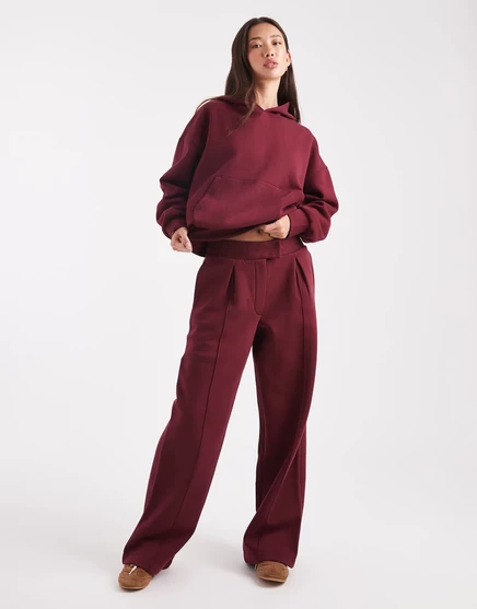 Спортивные брюки ASOS DESIGN оверсайз, сшитые по индивидуальному заказу с кисточкой на спине, с детализацией швов бордового цвета burgundy