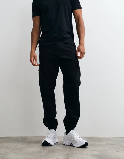 Узкие брюки-карго Jack &amp Jones с манжетами черного цвета black