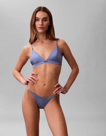 Фирменные атласные стринги-танга Calvin Klein синего цвета