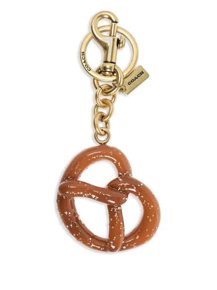 Брелок-подвеска Coach с кренделем, золотистый