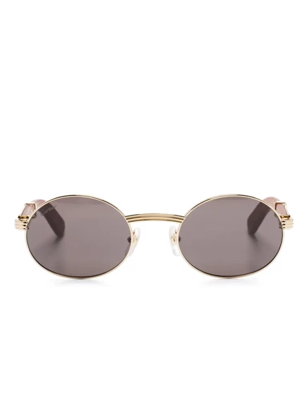 Солнцезащитные очки Cartier Eyewear в овальной оправе gold