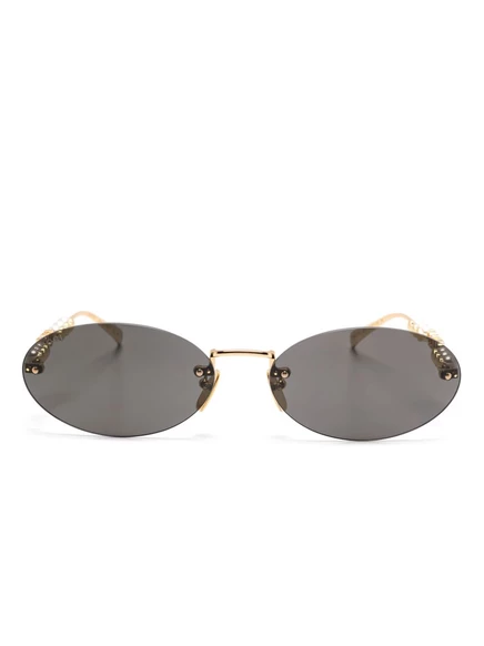 Женские солнцезащитные очки Gucci Eyewear овальные, золотистые