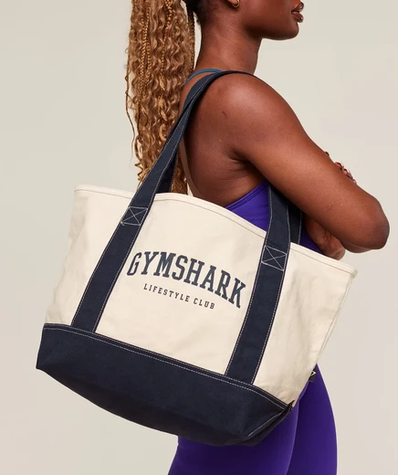 Сумка-тоут Gymshark Collegiate Oversized, молочно-бежевая/темно-синяя