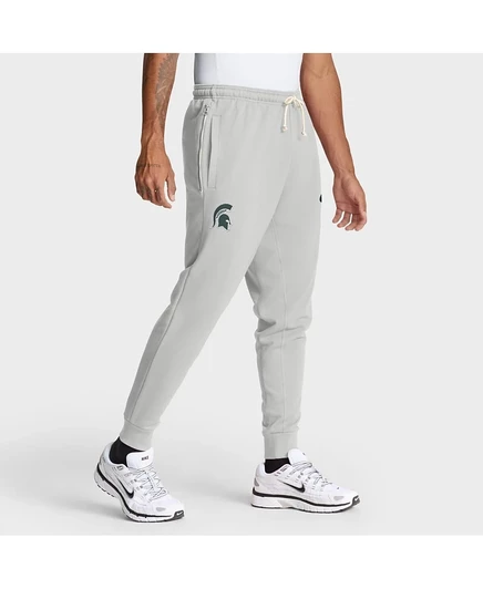 Мужские серые брюки Nike Michigan State Spartans 2025 Sideline Standard, зауженные к низу, серого цвета