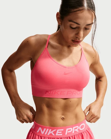 Женский спортбюстгальтер Nike Pro Seamless лёгкой поддержки, коралловый