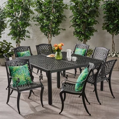 Традиционный обеденный гарнитур из литого алюминия Cayman Outdoor из 9 частей с круглым плетеным столом черного цвета диаметром 61,25 дюйма