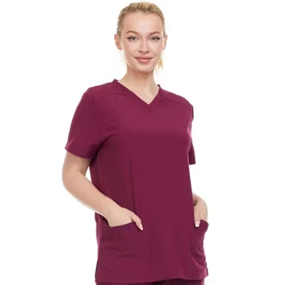 Женский эластичный медицинский топ-скраб HEAL+WEAR с V–образным вырезом и 2 накладными карманами - Растягивается в 4 стороны - Мягкая и профессиональная посадка.
