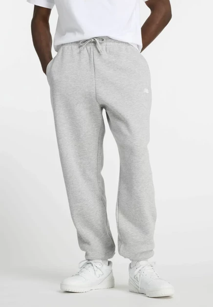 New Balance SPORT ESSENTIALS JOGGER - Tracksuit bottoms - sport green athletic grey ag