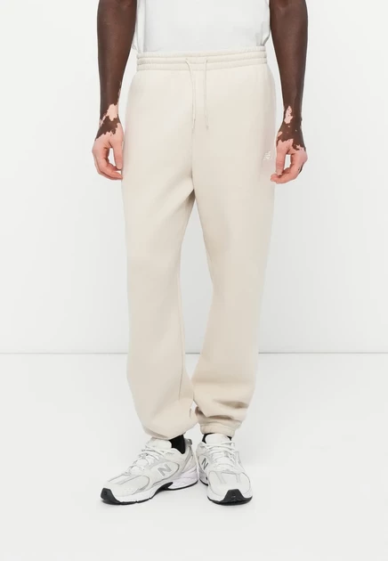 New Balance SPORT ESSENTIALS JOGGER - Tracksuit bottoms - sport green grey