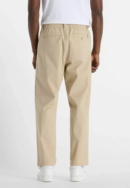 Мужские брюки New Balance ATHLETICS RELAXED, графитовые