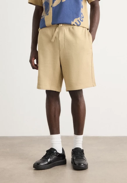 HUGO DAYONO - Tracksuit bottoms - black medium beige