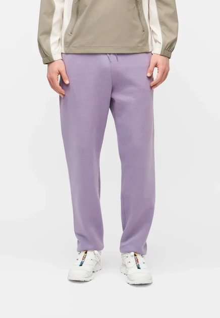 New Balance SPORT ESSENTIALS JOGGER - Tracksuit bottoms - sport green candied violet